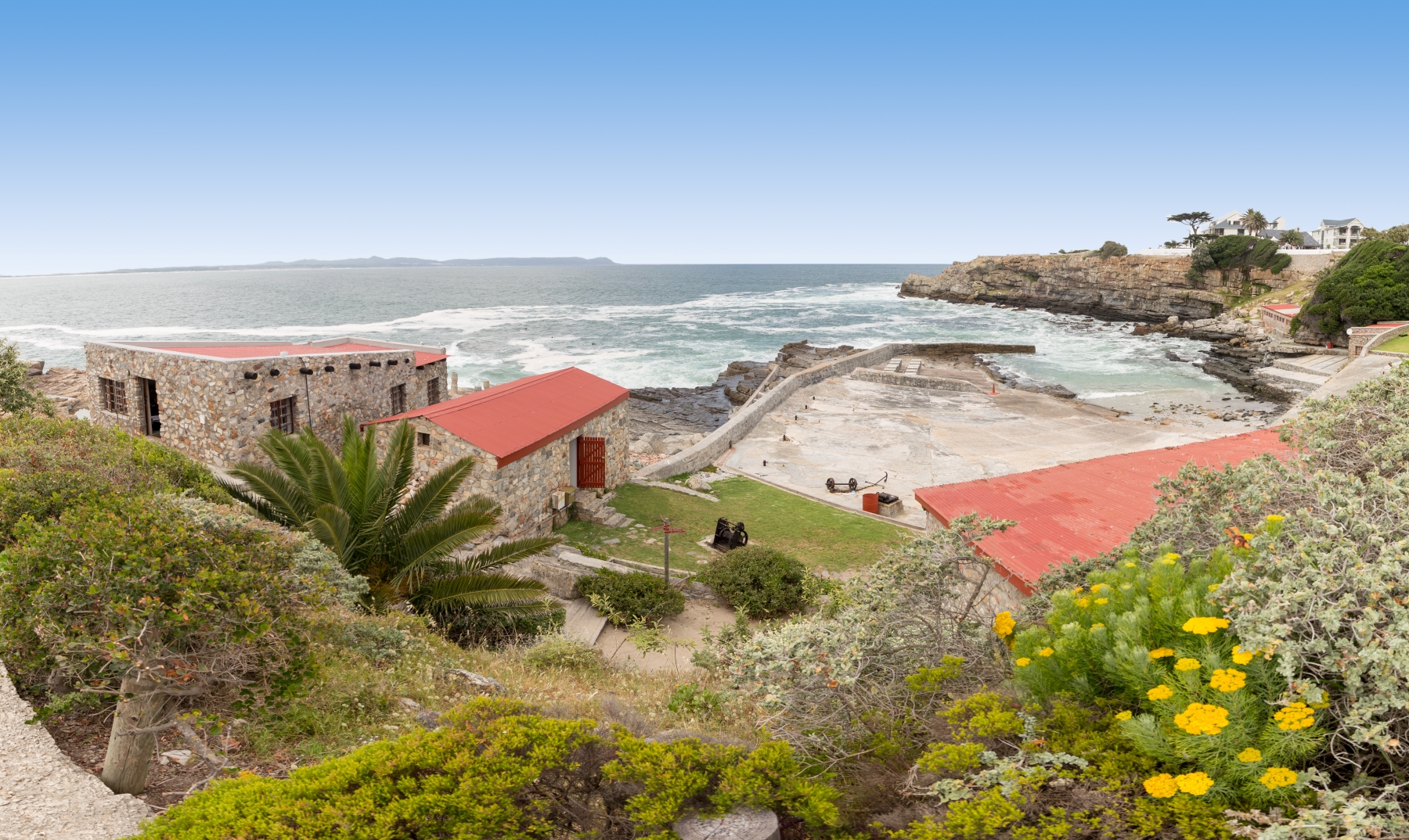 Old Port in Hermanus The Old Harbour Museum overlooks the sea, just steps from prime whale watching in Hermanus