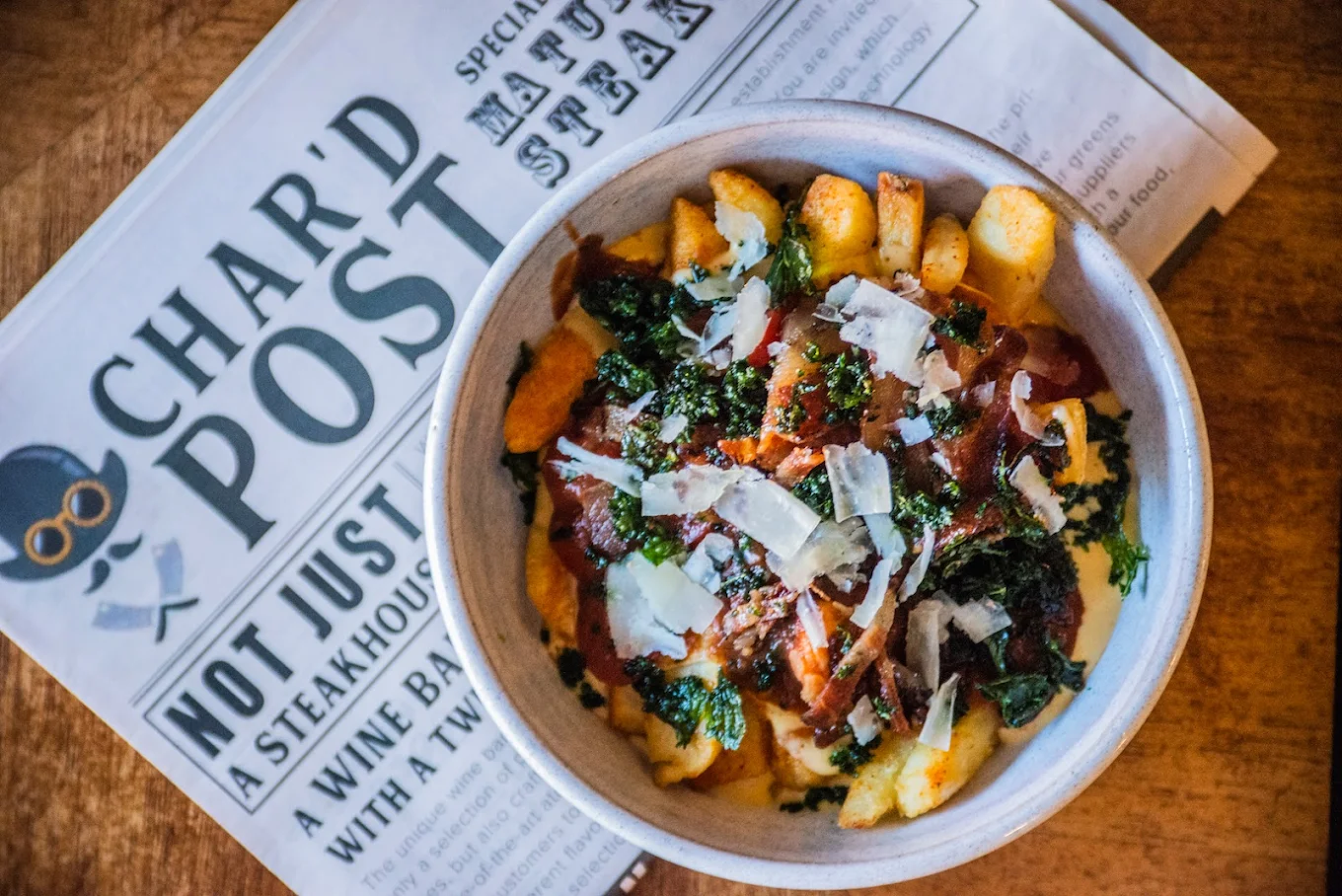 Char’d Grill & Wine Bar Cheese sauce loaded fries at Char'd